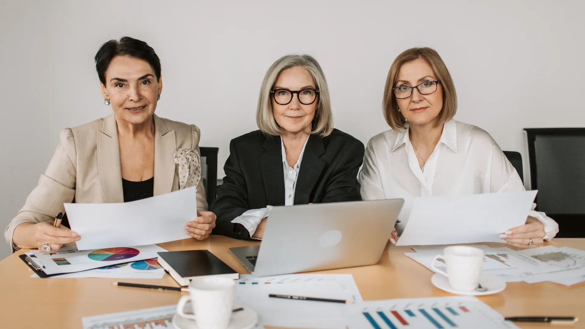 Business owner analyzing ERC buyout cash flow benefits on a laptop.